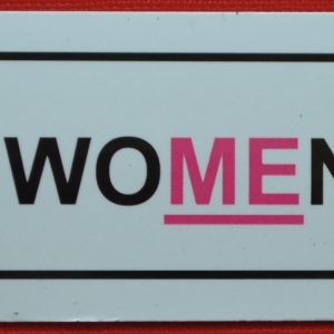 A pink magnet with an underline for Treat Women Right.