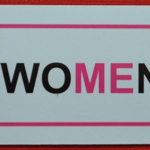 A pink magnet with a border and underline for Treat Women Right.