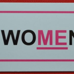 A pink magnet with an underline for Treat Women Right.