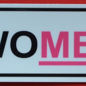 A pink and black sticker with an underline for Treat Women Right.