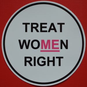 A black and pink car sticker with an underline for Treat Women Right.